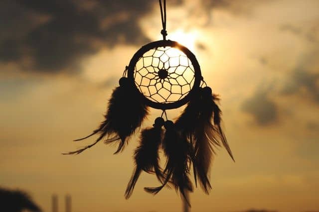 Dream Catcher craft item silhouette in front of sunset